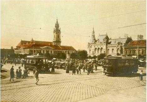 „HUB” DE TRANSPORT. La începutul anilor 1900, în Piața Unirii, numită pe atunci Szent László, se intersectau primele trei linii de tramvai înființate în oraș. Linia 1 venea dinspre Piața Mare (acum Parcul 1 Decembrie) și mergea spre gară, linia 2 pornea către cazărmile din Calea Aradului, iar linia 3 lua drumul Grădinii Rhédey, acum Parcul Bălcescu. Liniile s-au întâlnit aici timp de zeci de ani, până în anii 1970, când o parte dintre ele au fost desființate. Tot aici se întretăiau și principale rute rutiere, în zonă existând o „stație” de birje, iar mai târziu de autobuz
