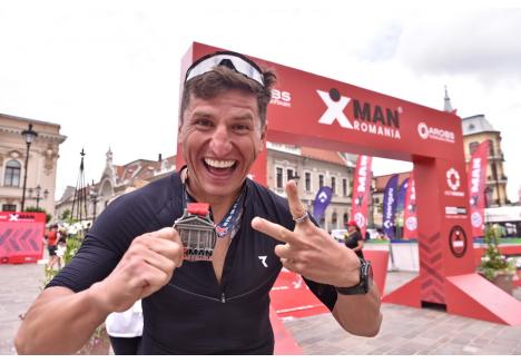 Mihai Vigariu (foto) a câștigat titlul de „Ironman”, după ce a fost primul bărbat care a finalizat probele de triatlon (foto: Szilagyi Lorand)