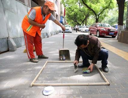 Praful de pe străzile din China este cântărit, pentru evaluarea muncitorilor de la salubritate