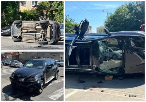 Accident în Oradea: Un BMW și un Renault s-au ciocnit. Cea de-a doua mașină s-a răsturnat, trafic blocat (FOTO / VIDEO)