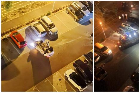 Tamponare neobișnuită în Oradea: O mașină a ajuns cu roțile în sus pe strada Oneștilor (FOTO / VIDEO)