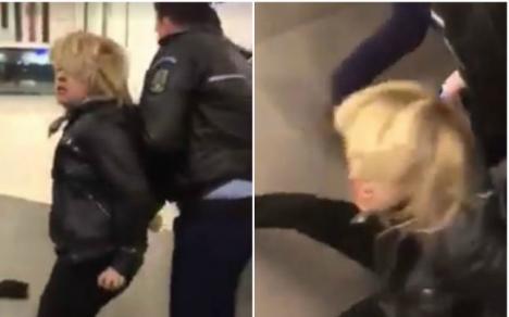 Scandal la mall: Femeie reţinută, după ce i-a lovit pe poliţiştii sesizaţi că aceasta şi-a lovit copilul (VIDEO)