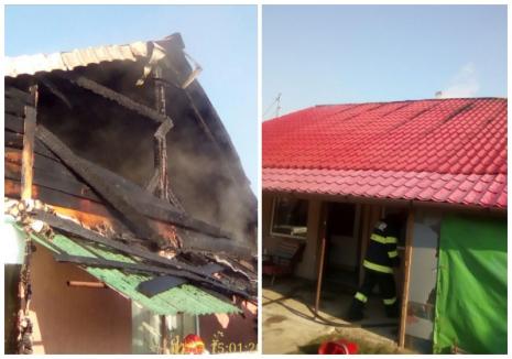 Acoperișul unei case din Bihor, distrus de flăcări, din cauza... afumătorii! (FOTO)