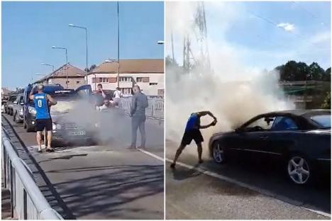 O maşină a luat foc pe Podul Carol I din Oradea. Un pompier aflat în timpul liber şi alţi orădeni au sărit să ajute (VIDEO)