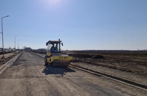Pe terminate. Drumul colector dintre Leroy Merlin și Piața 100 urmează să fie asfaltat (FOTO / VIDEO)