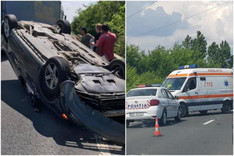 Accident pe DN79, în Bihor: O şoferiţă însărcinată a intrat cu un Audi în spatele unui tractor cu remorcă