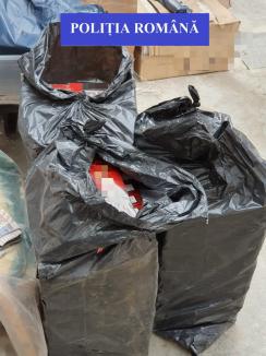 Peste 12.000 pachete de ţigări descoperite la patronul unui local din Oradea. Bărbatul a mai fost reţinut pentru contrabandă