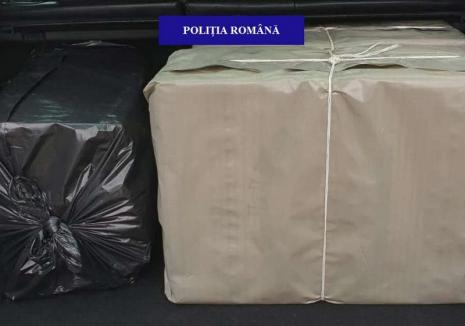 Cutii cu mii de pachete de ţigări de contrabandă, confiscate din maşina unui orădean. Cum l-au pedepsit poliţiştii (FOTO)